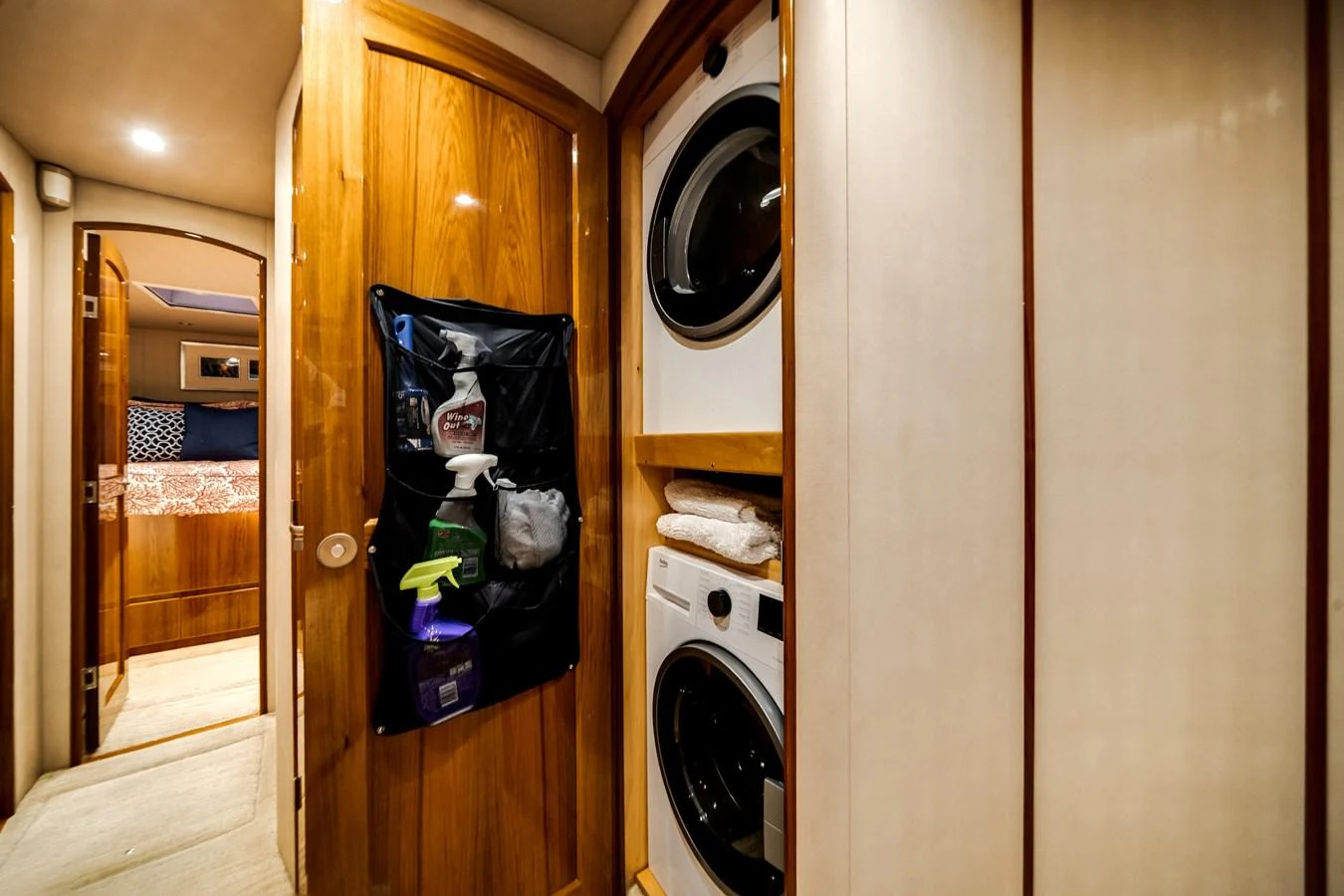 a closet with a washing machine aboard EL JEFE Yacht for Sale