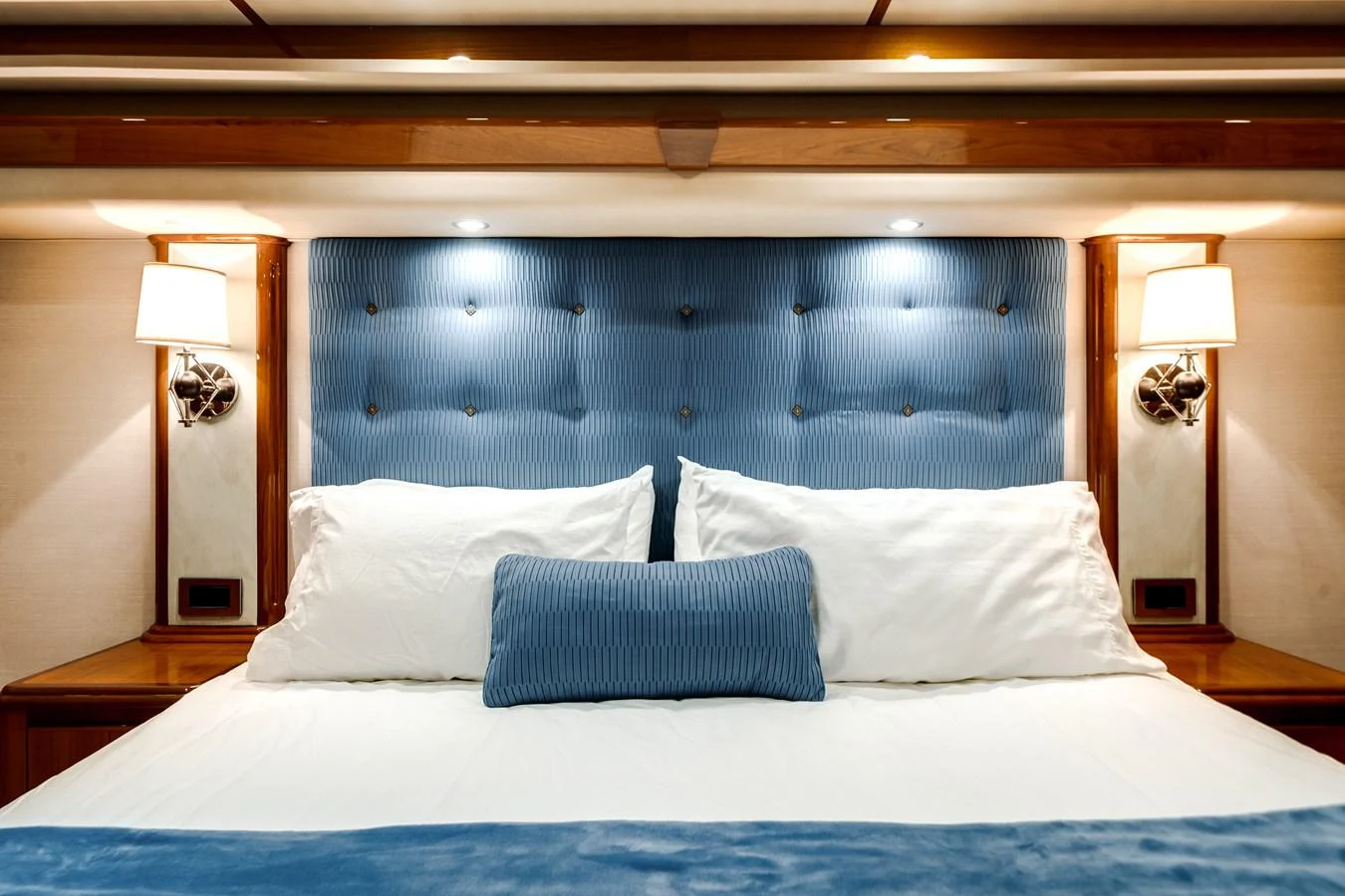 a bed with white sheets aboard EL JEFE Yacht for Sale