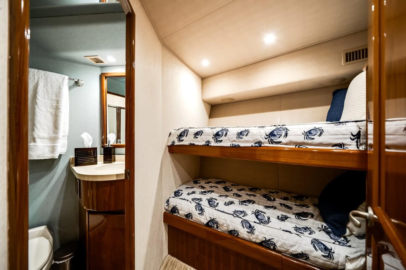 a bedroom with a bunk bed aboard EL JEFE Yacht for Sale