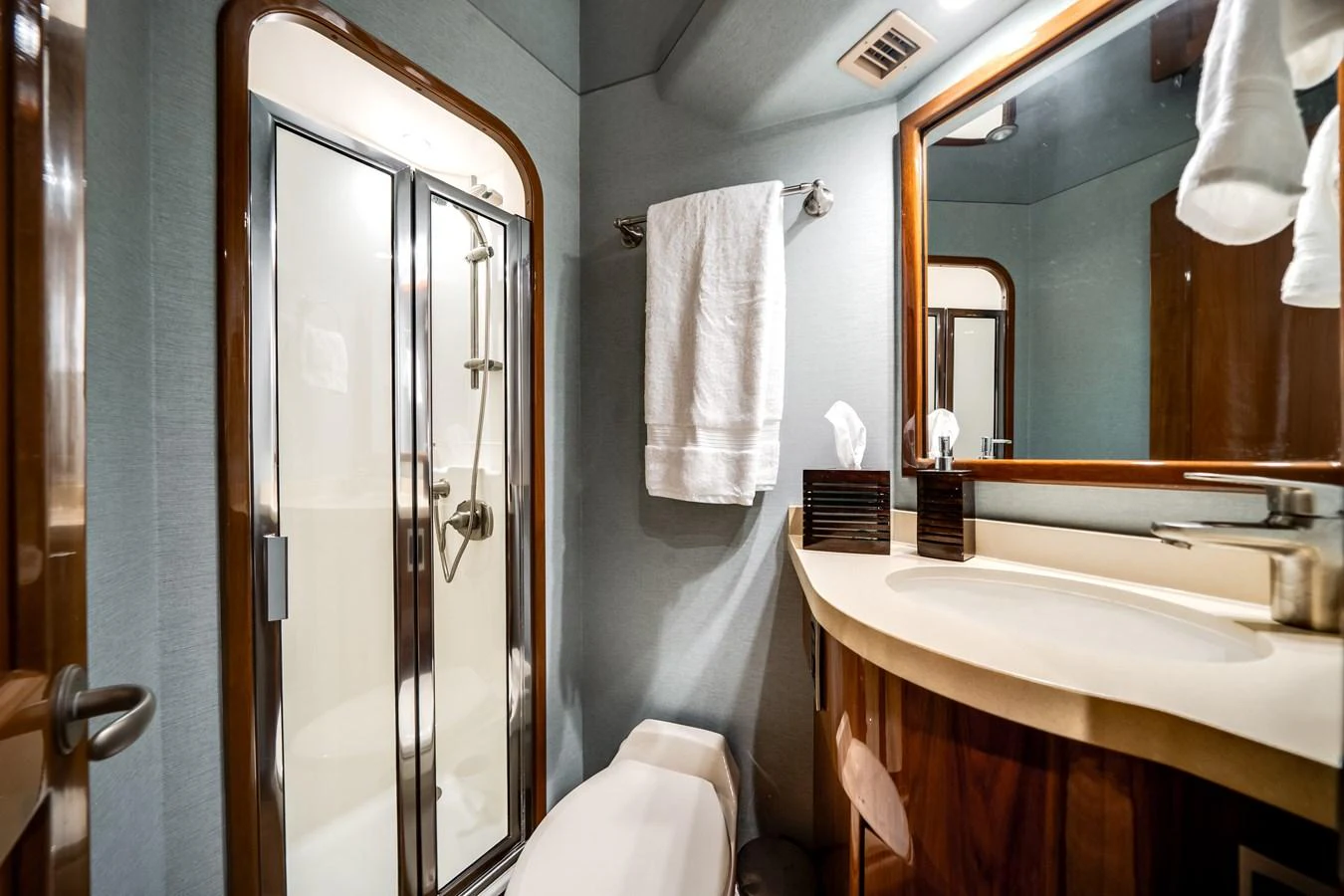 a bathroom with a large mirror aboard EL JEFE Yacht for Sale