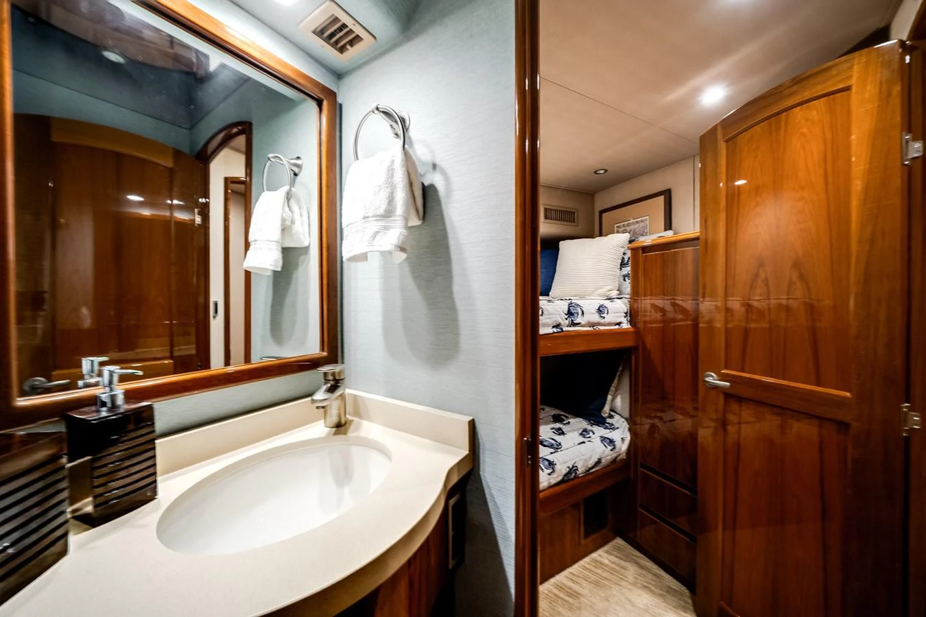 a bathroom with a sink and mirror aboard EL JEFE Yacht for Sale