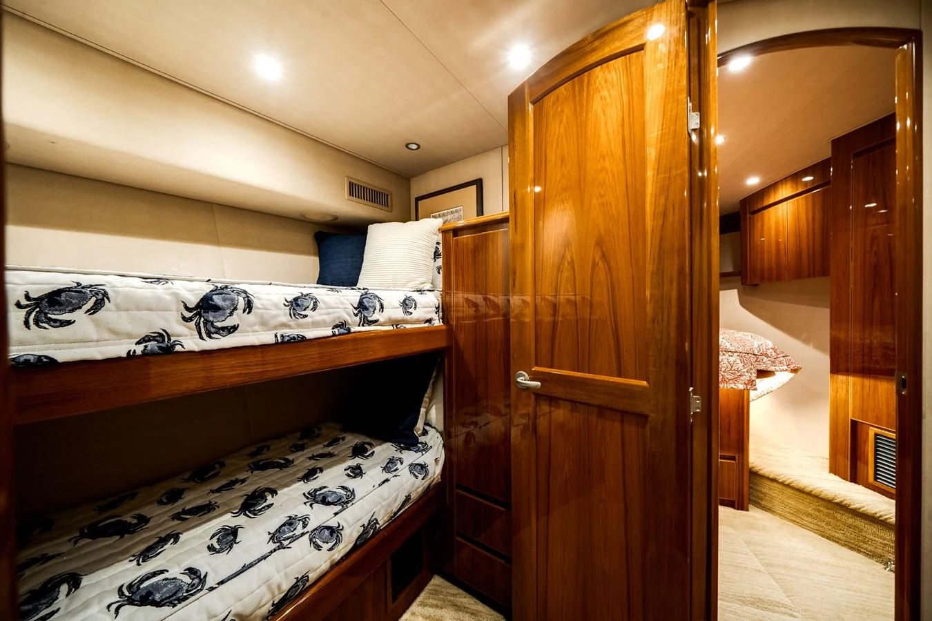 a bedroom with a bed and a closet aboard EL JEFE Yacht for Sale