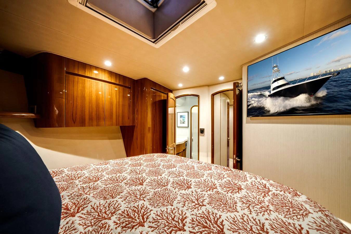 a bedroom with a large bed aboard EL JEFE Yacht for Sale