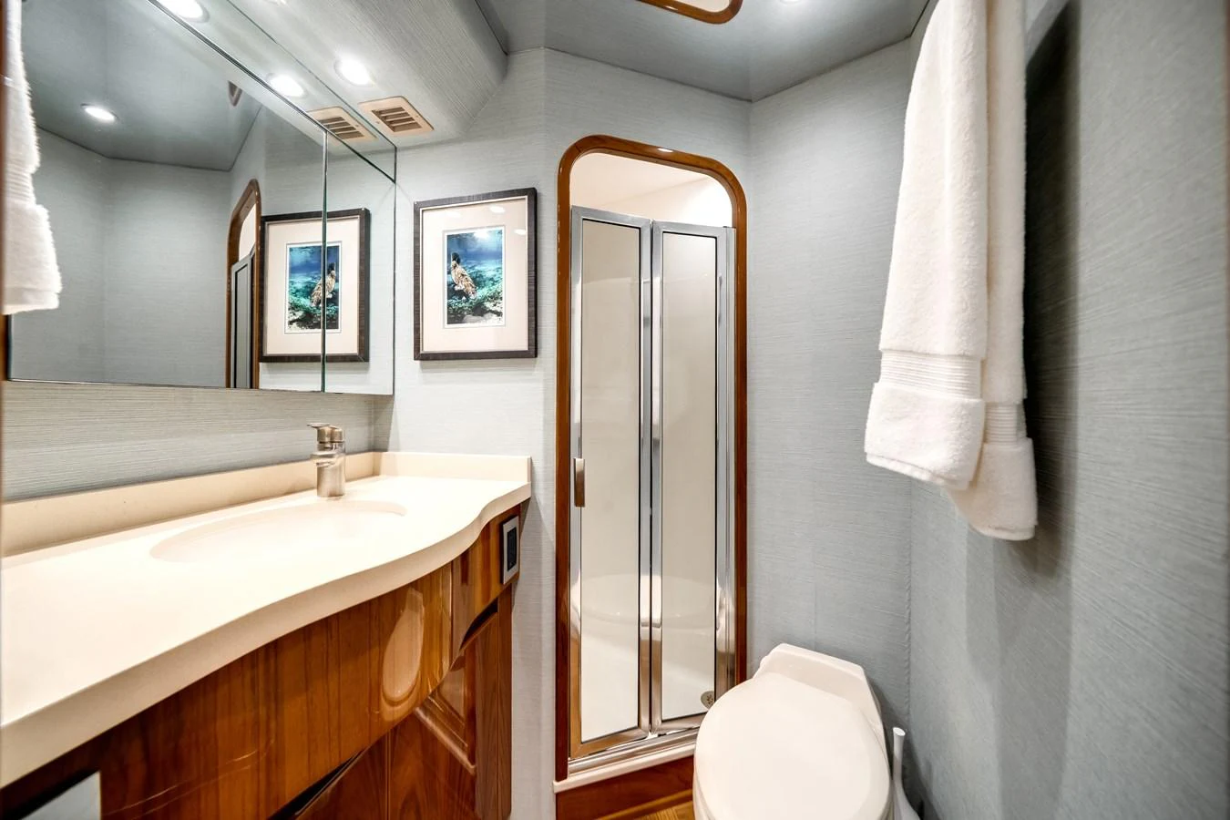 a bathroom with a sink and a mirror aboard EL JEFE Yacht for Sale