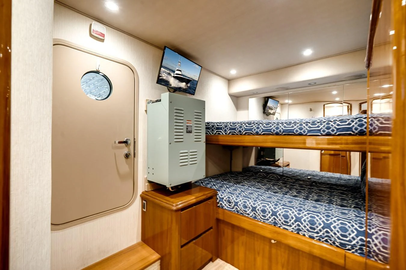 a room with a bed and a closet aboard EL JEFE Yacht for Sale