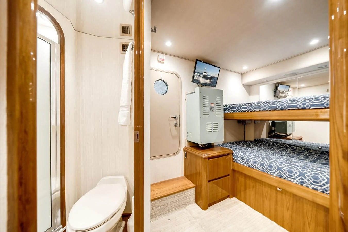 a room with a bed and a desk aboard EL JEFE Yacht for Sale