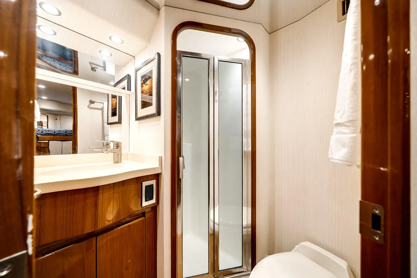a bathroom with a glass shower aboard EL JEFE Yacht for Sale