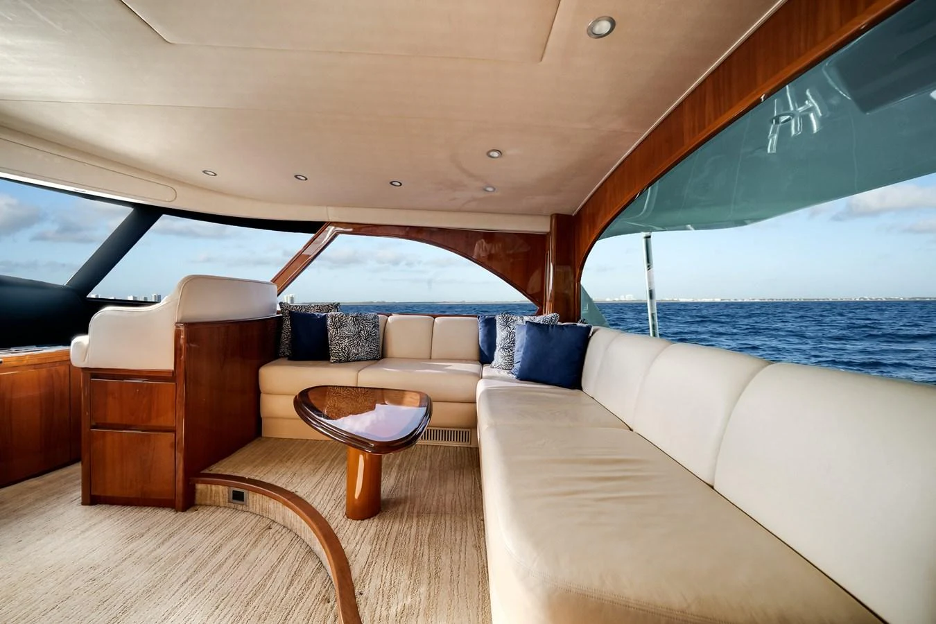 a boat with a couch and a table in it aboard EL JEFE Yacht for Sale