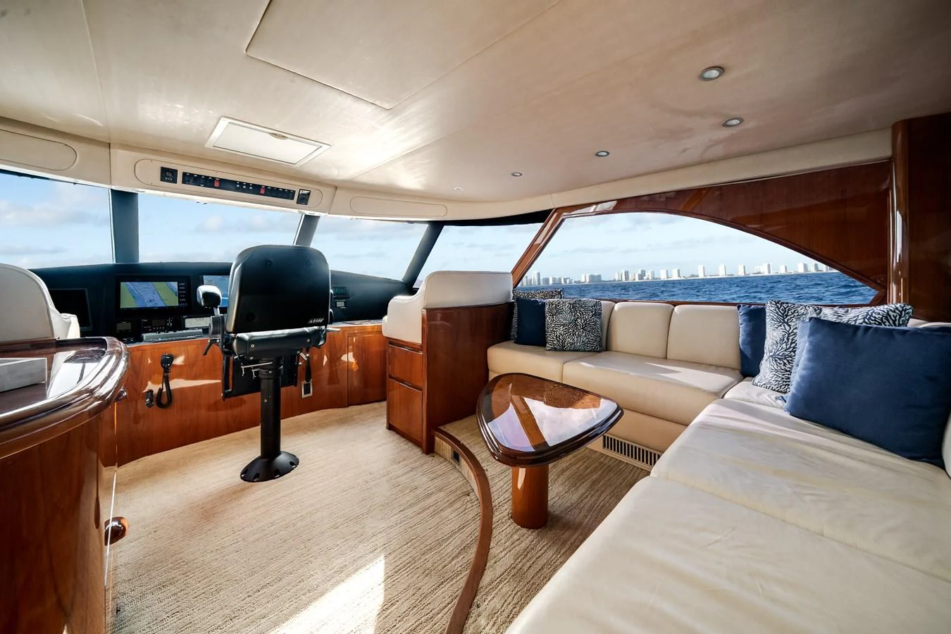 a room with a bed and a chair aboard EL JEFE Yacht for Sale