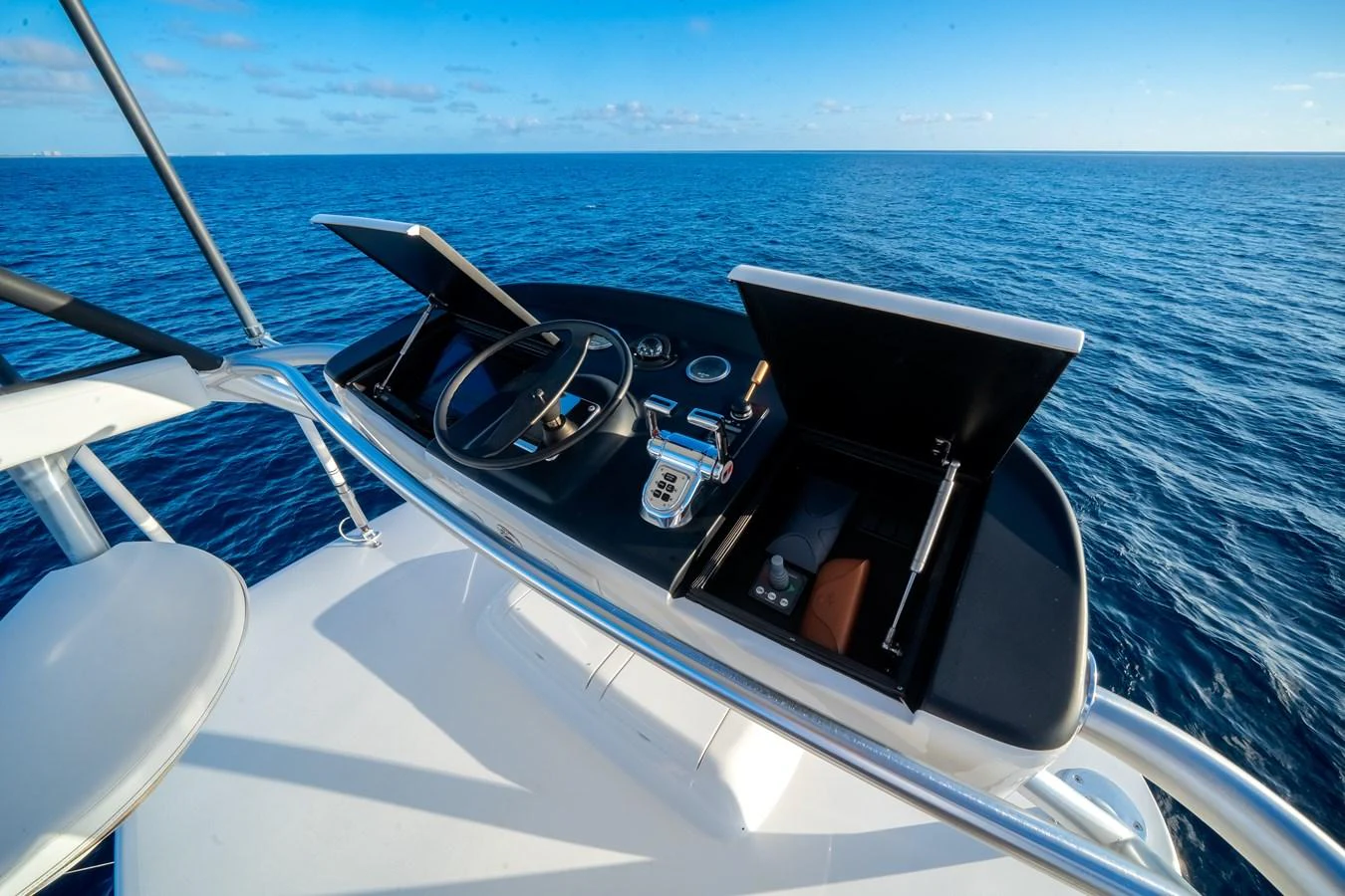 a boat with a steering wheel and a steering wheel on the front aboard EL JEFE Yacht for Sale