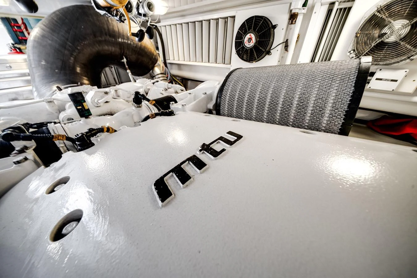a white car with a white hood aboard EL JEFE Yacht for Sale
