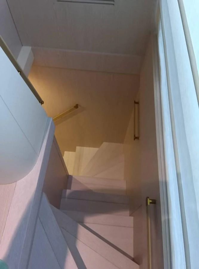 a white tiled bathroom aboard ANGEL Yacht for Sale