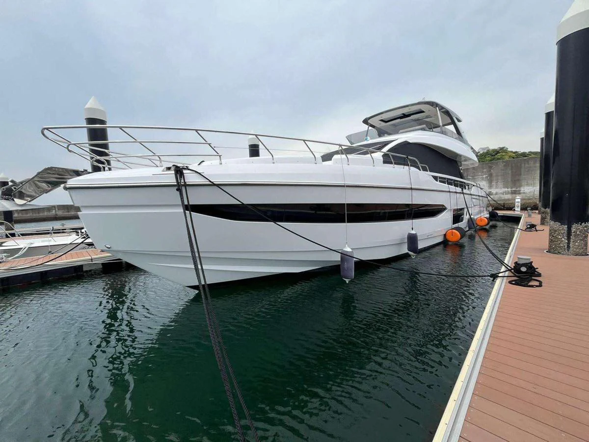 a white boat docked aboard ANGEL Yacht for Sale