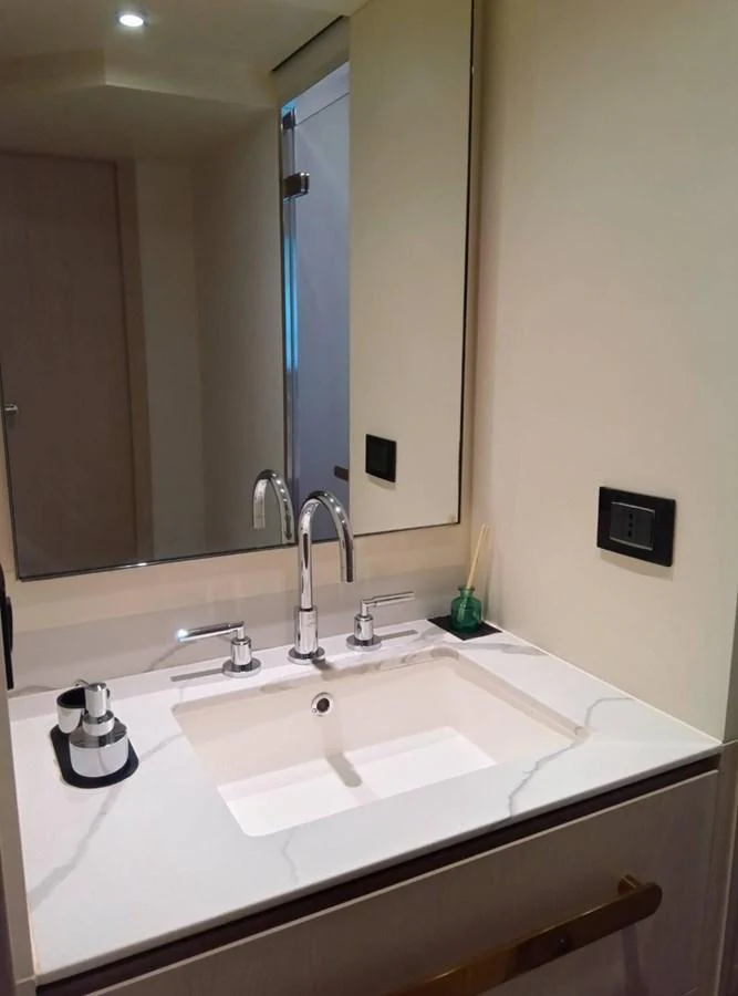 a bathroom with a sink and mirror aboard ANGEL Yacht for Sale