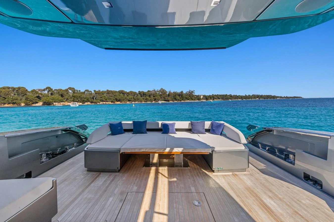 a deck with a view of the water and a beach aboard SAMIRA Yacht for Sale