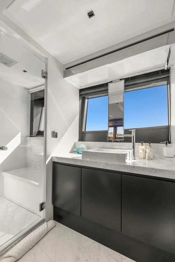 a bathroom with a large window aboard SAMIRA Yacht for Sale