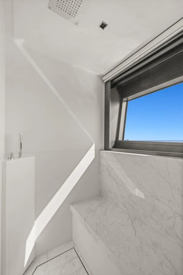 a white wall with a window aboard SAMIRA Yacht for Sale