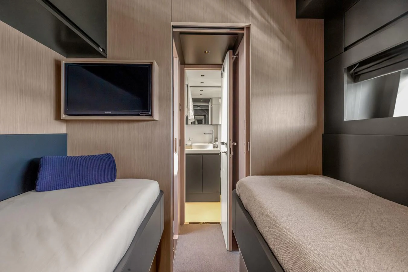 a small room with a bed and a television aboard SAMIRA Yacht for Sale