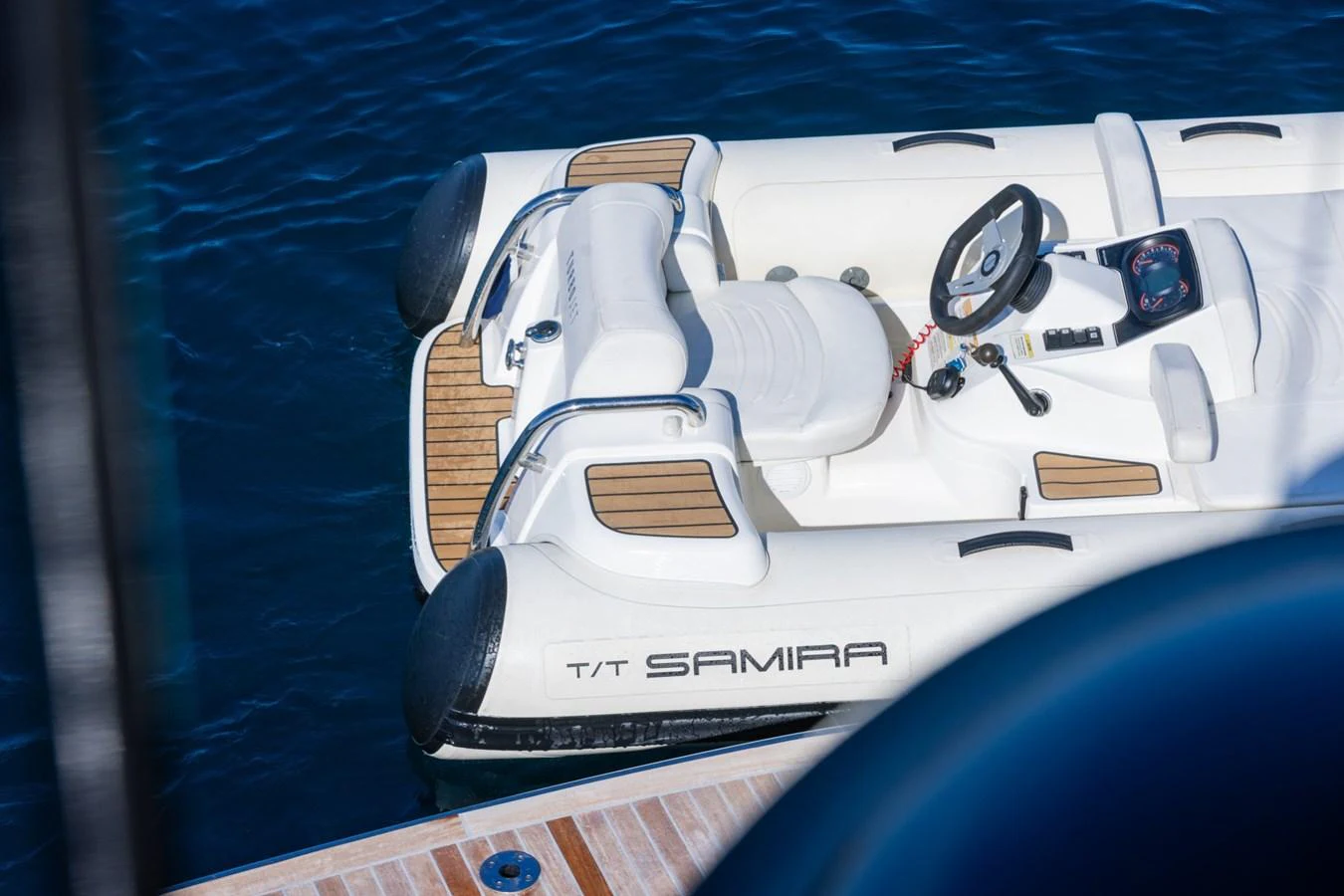 a white car with a white interior aboard SAMIRA Yacht for Sale