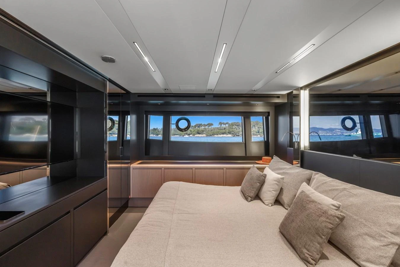 a room with a couch and a tv on the wall aboard SAMIRA Yacht for Sale