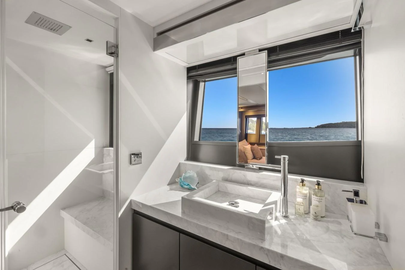 a bathroom with a large mirror aboard SAMIRA Yacht for Sale