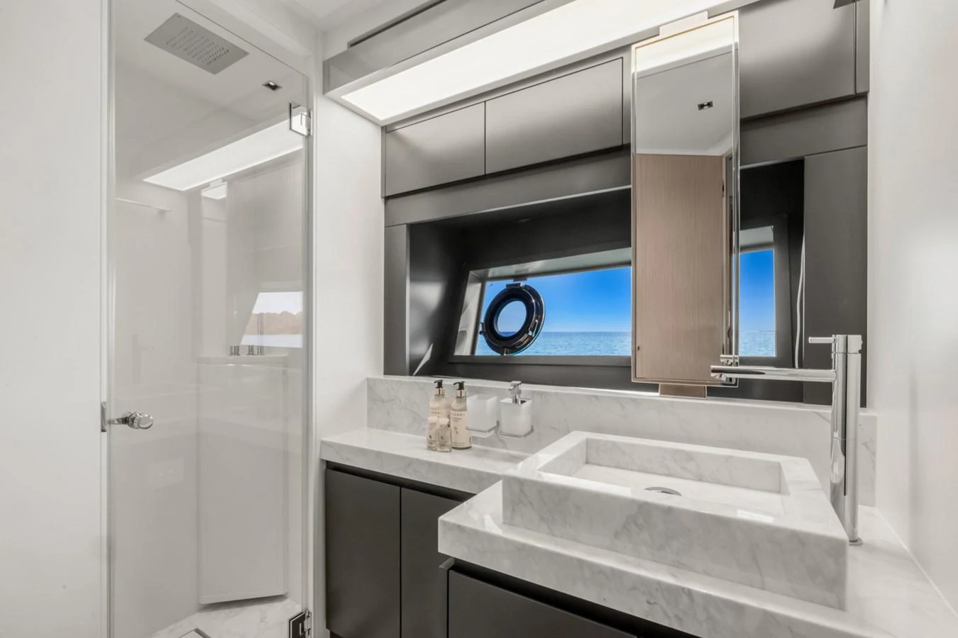 a bathroom with a sink and cabinets aboard SAMIRA Yacht for Sale