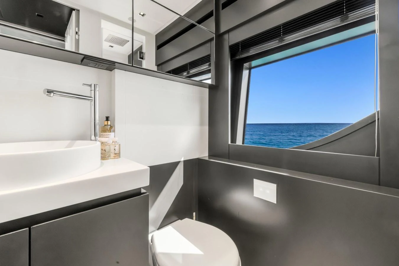a bathroom with a window aboard SAMIRA Yacht for Sale