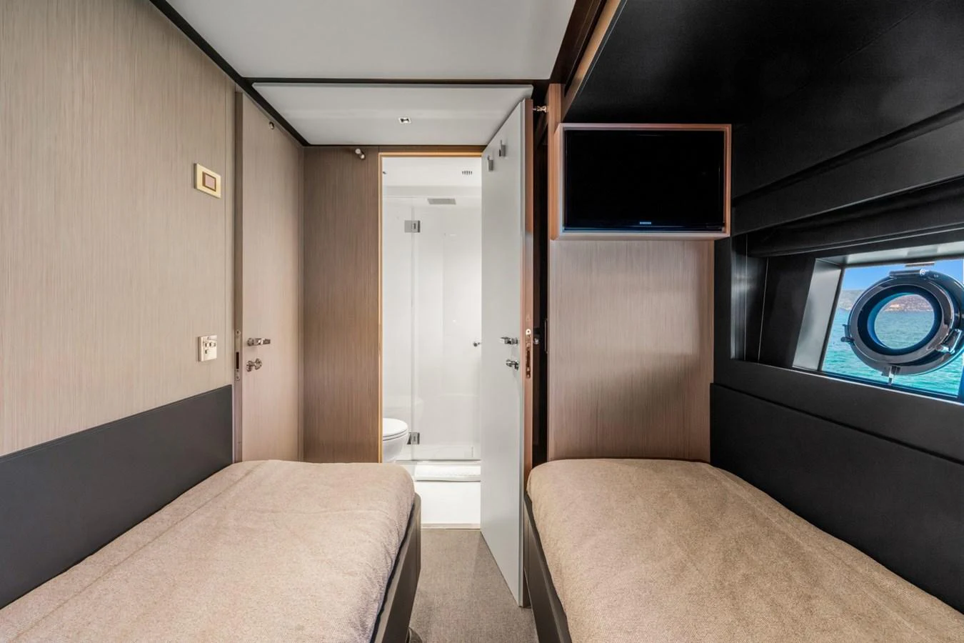 a room with a bed and a television aboard SAMIRA Yacht for Sale