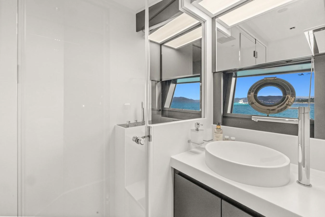 a bathroom with a sink and a mirror aboard SAMIRA Yacht for Sale