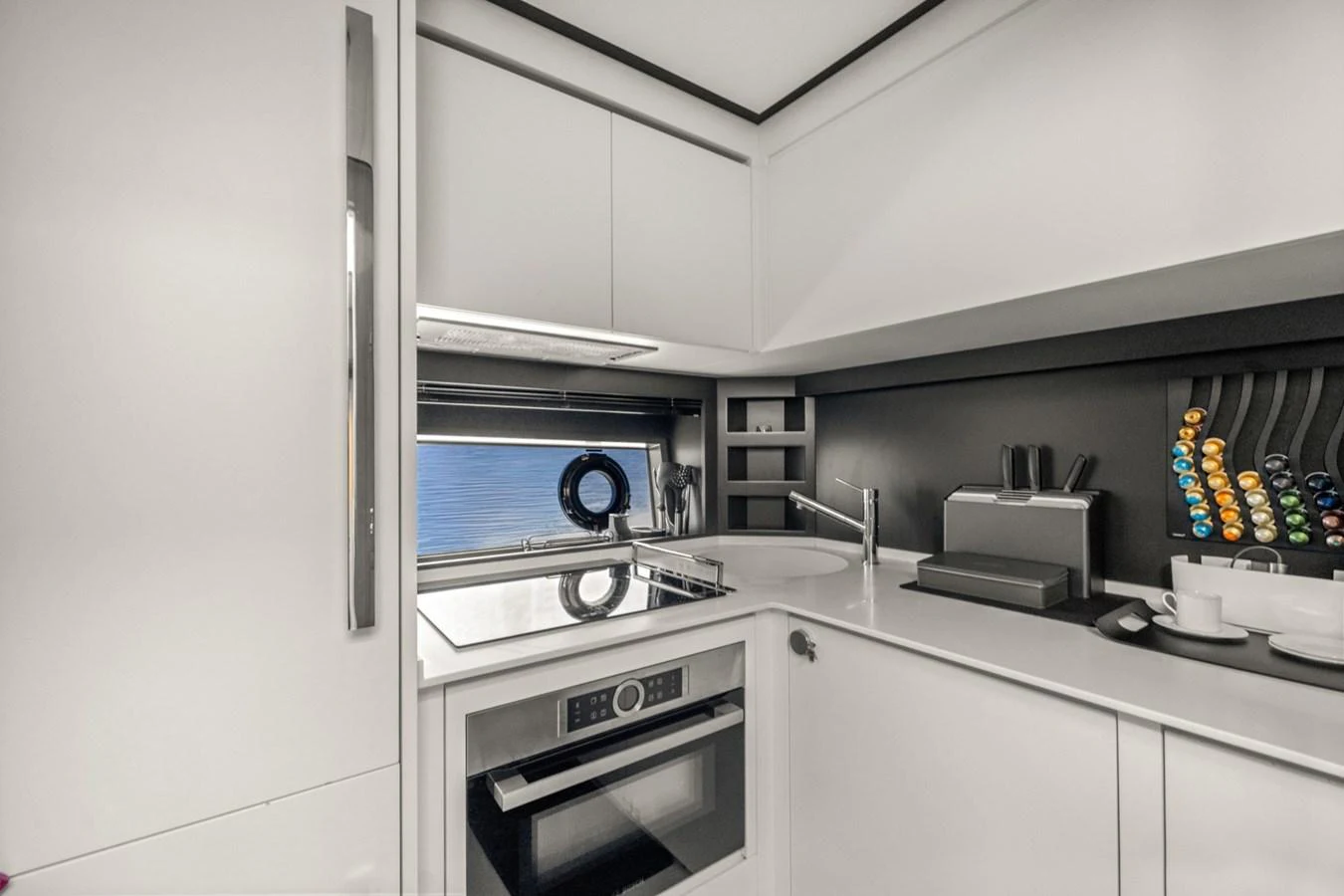 a kitchen with white cabinets aboard SAMIRA Yacht for Sale