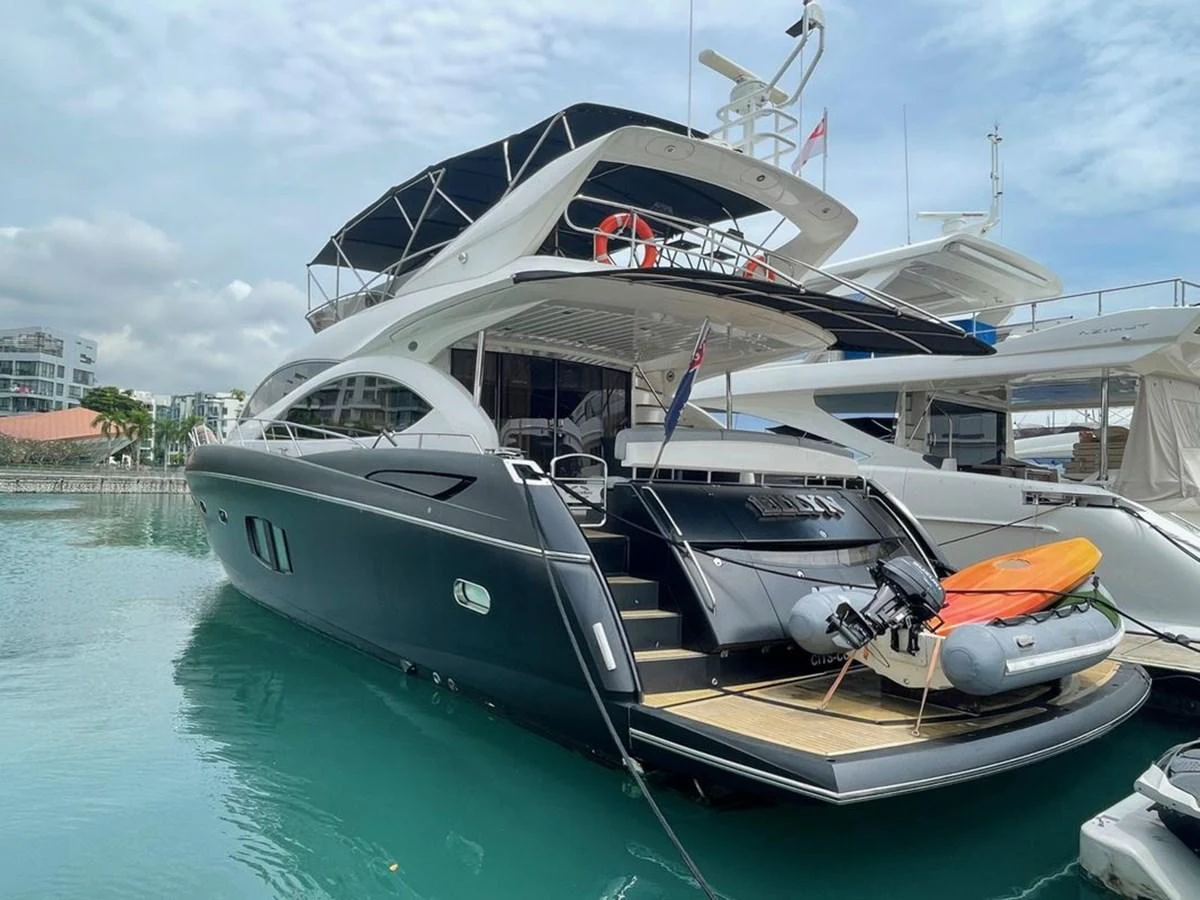 A sleek, modern yacht docked at a marina, showcasing its elegant design and luxurious amenities. aboard ELLYN Yacht for Sale