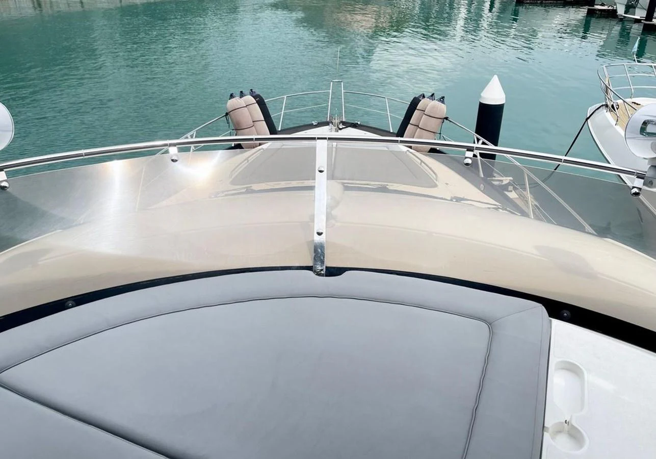 The foredeck features a spacious sunpad and a clear view of the water ahead. aboard ELLYN Yacht for Sale