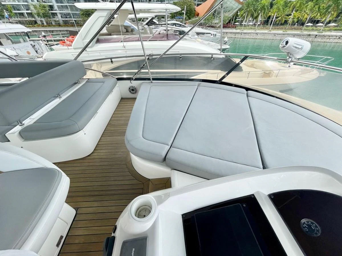 The flybridge offers a spacious and comfortable lounging area with sleek, modern seating. aboard ELLYN Yacht for Sale