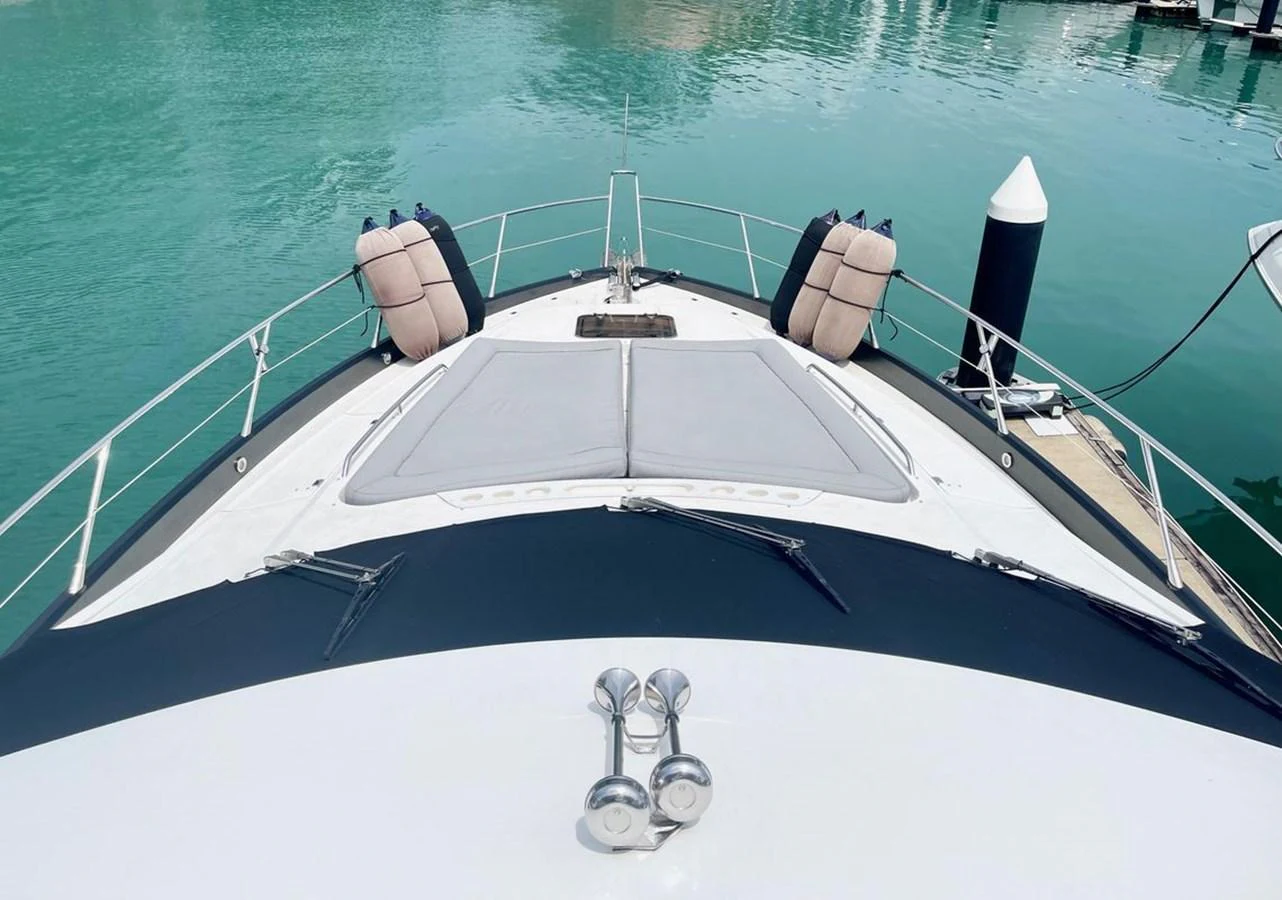 The foredeck features a spacious sunbathing area with plush cushions, perfect for relaxation. aboard ELLYN Yacht for Sale
