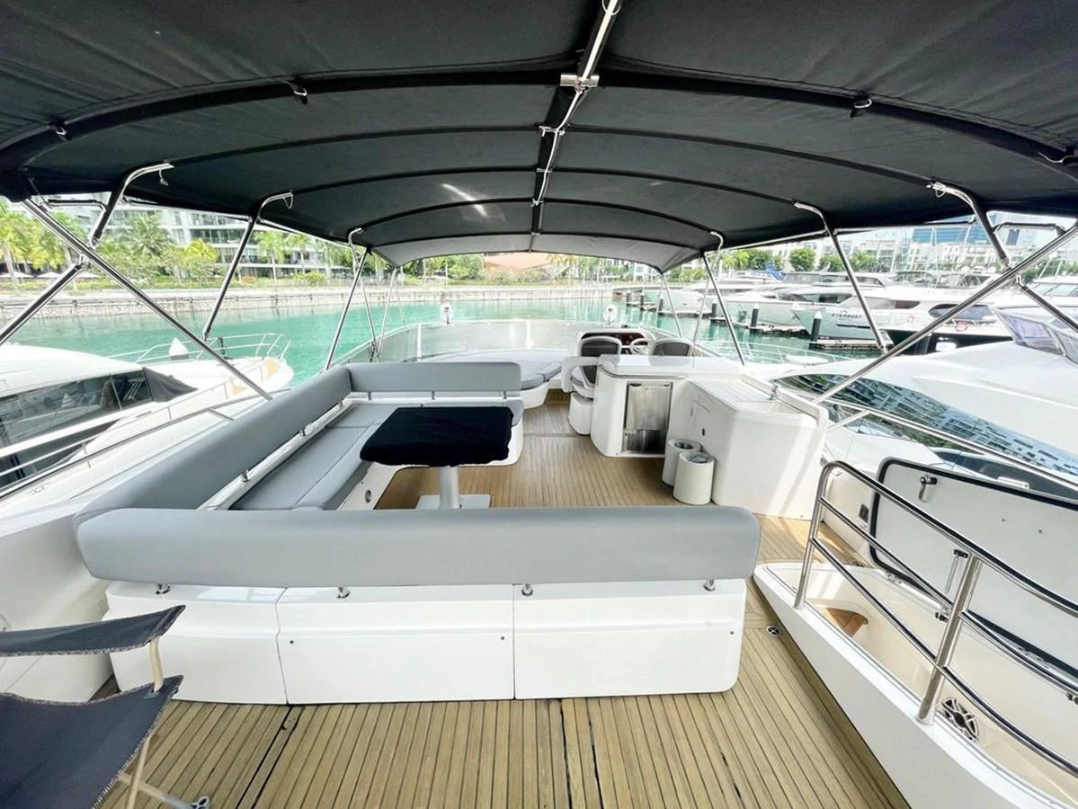 The flybridge offers a spacious and shaded area with ample seating and a beautiful view of the marina. aboard ELLYN Yacht for Sale