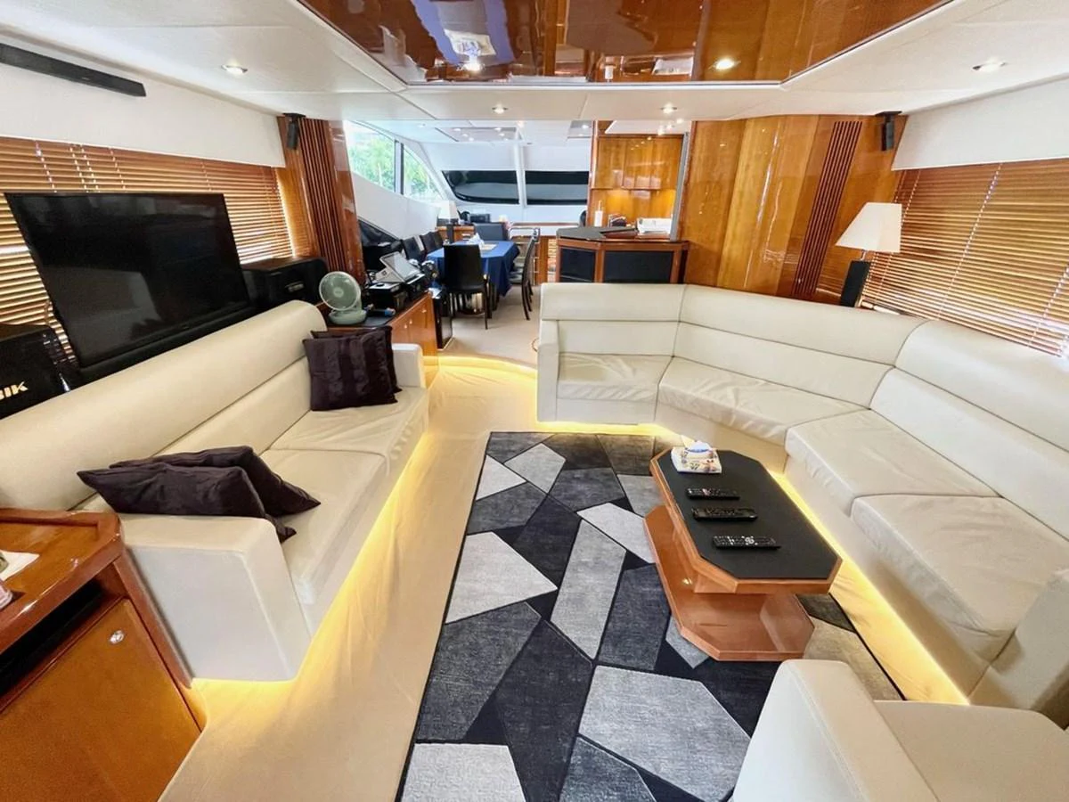 The yacht's salon features plush seating, a modern entertainment system, and elegant lighting. aboard ELLYN Yacht for Sale