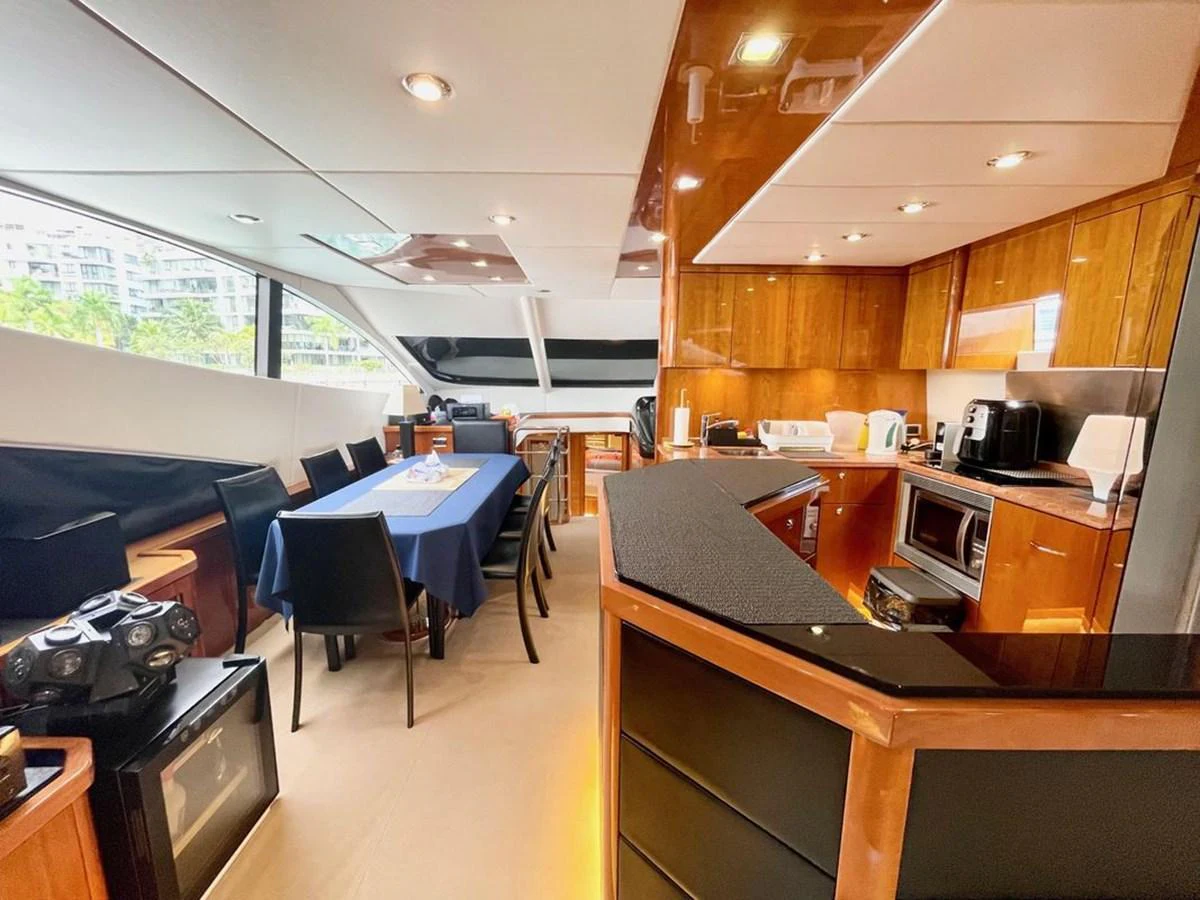 The yacht's galley and dining area feature modern amenities and a sleek design. aboard ELLYN Yacht for Sale