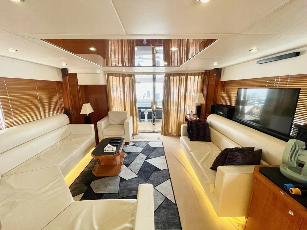 The salon features plush seating, a large TV, and elegant decor, creating a luxurious and comfortable atmosphere. aboard ELLYN Yacht for Sale