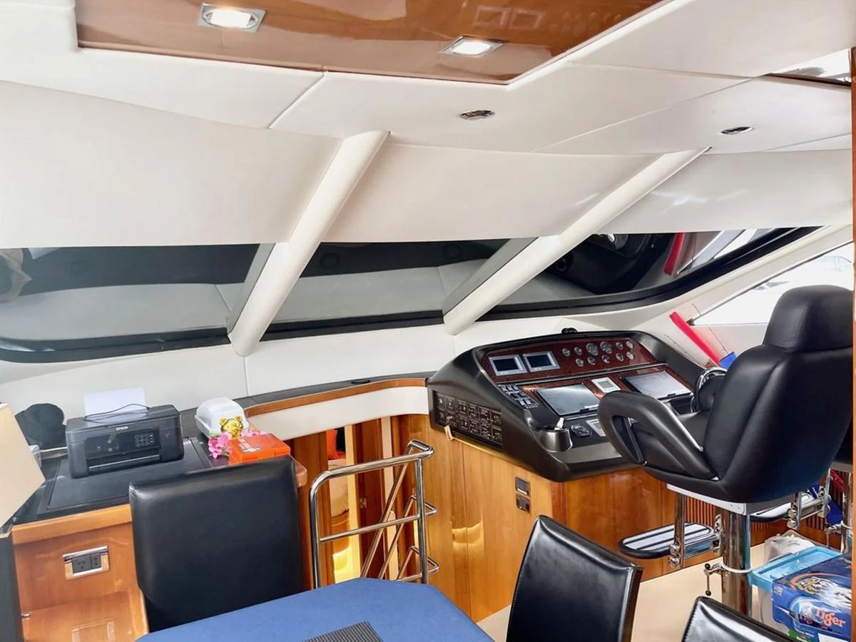 The helm station features a sleek design with modern navigation equipment and comfortable seating. aboard ELLYN Yacht for Sale