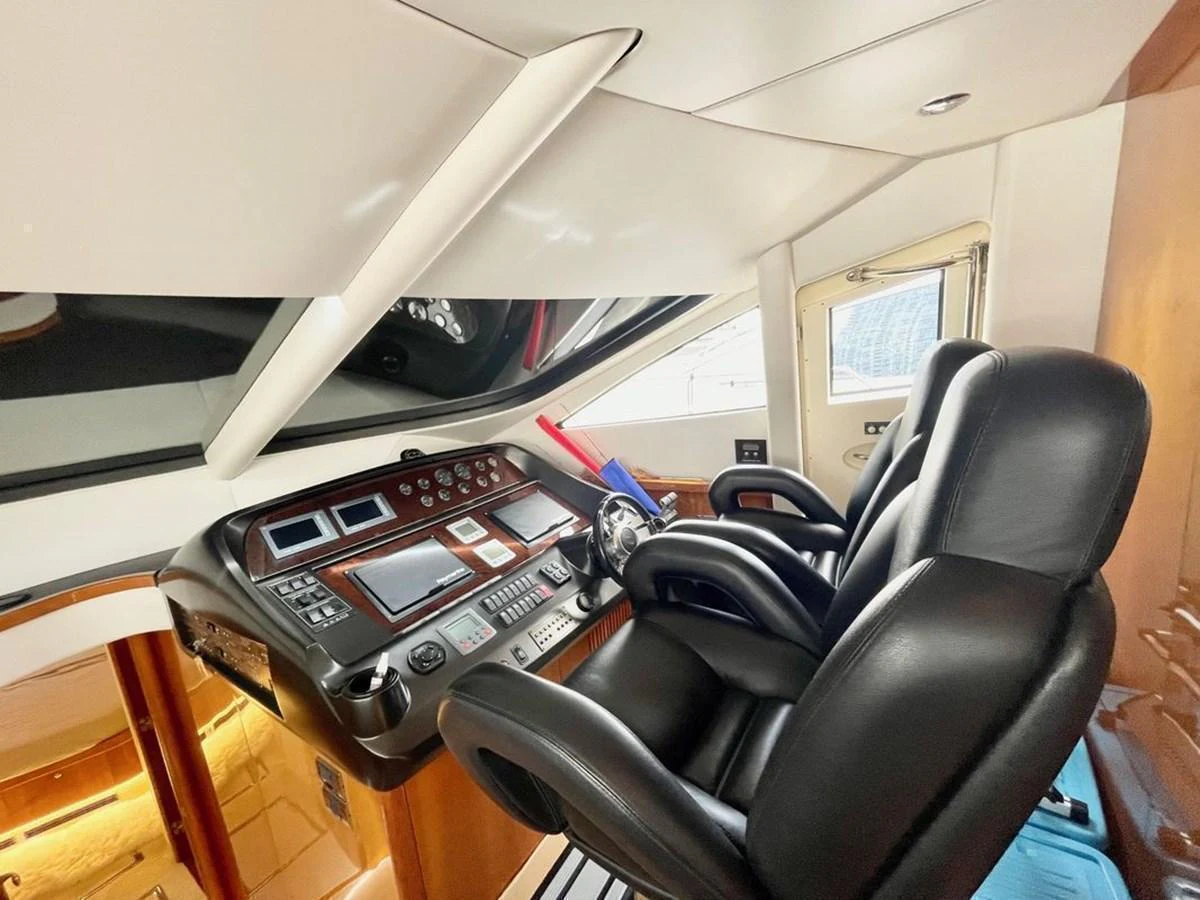 The helm station features modern navigation equipment and luxurious seating. aboard ELLYN Yacht for Sale