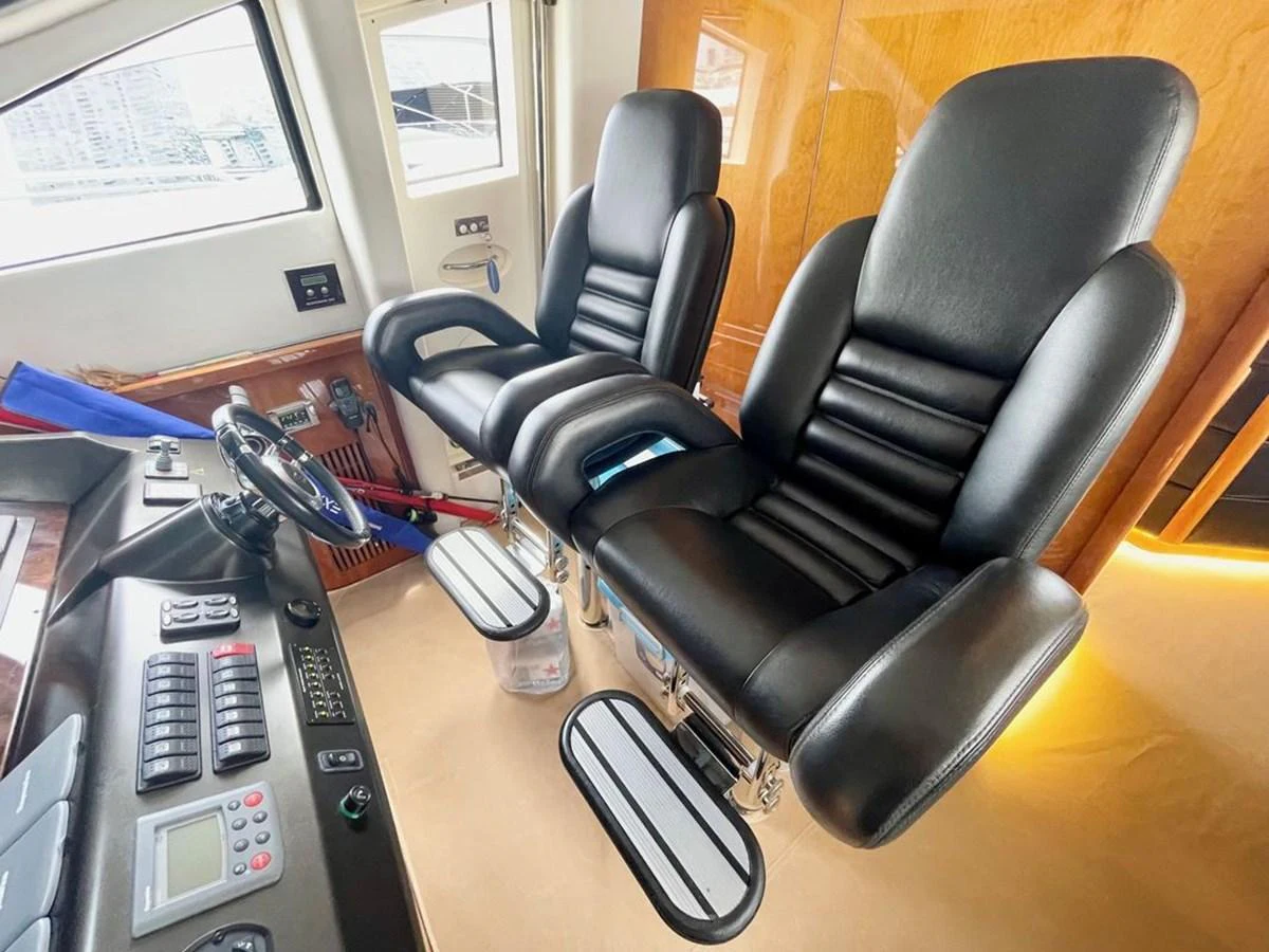 The helm features luxurious black leather captain's chairs and state-of-the-art navigation equipment. aboard ELLYN Yacht for Sale