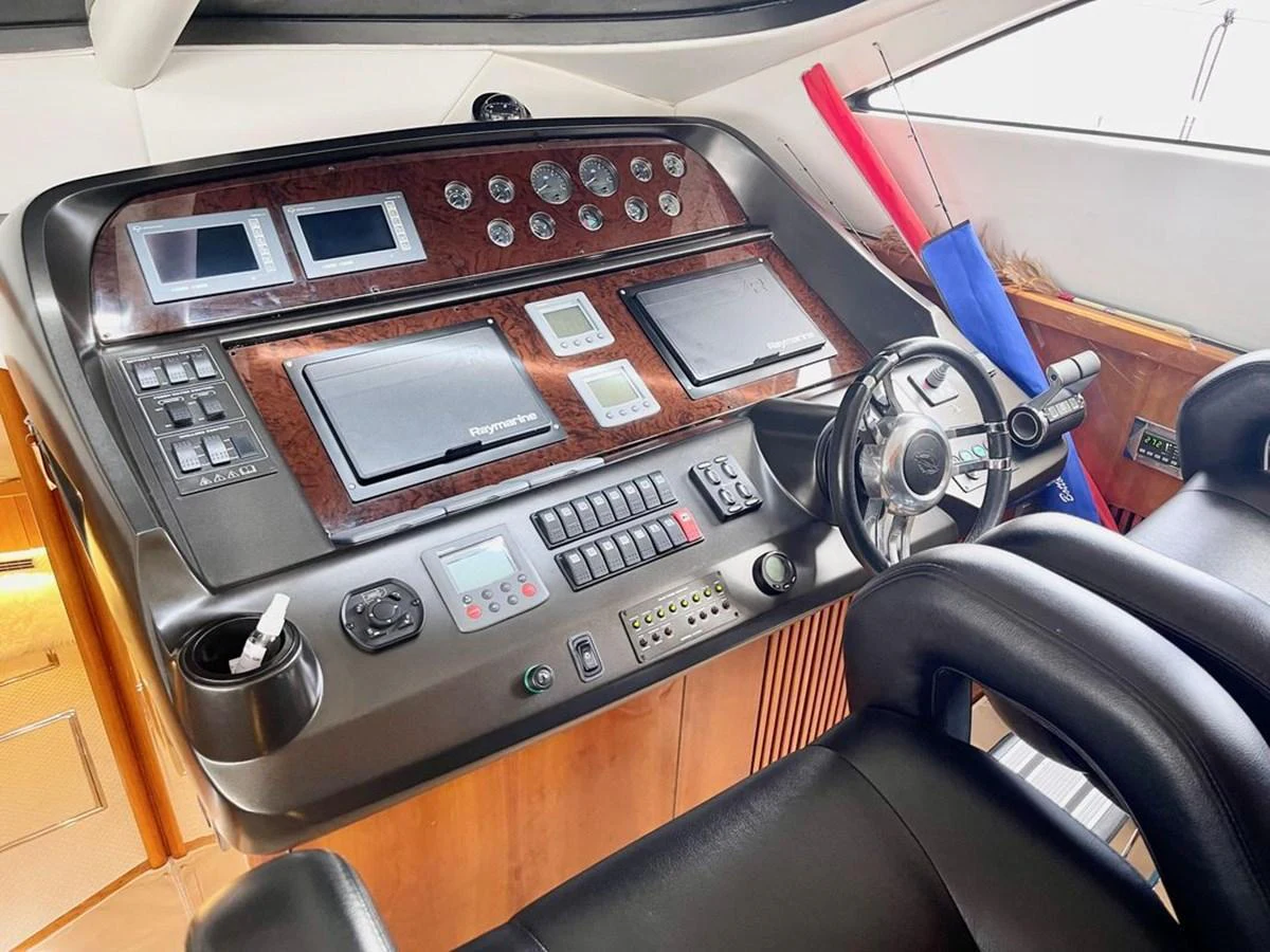The helm station features advanced navigation equipment and luxurious seating. aboard ELLYN Yacht for Sale
