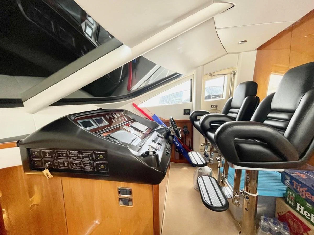 The helm station features modern controls and comfortable seating for navigation. aboard ELLYN Yacht for Sale