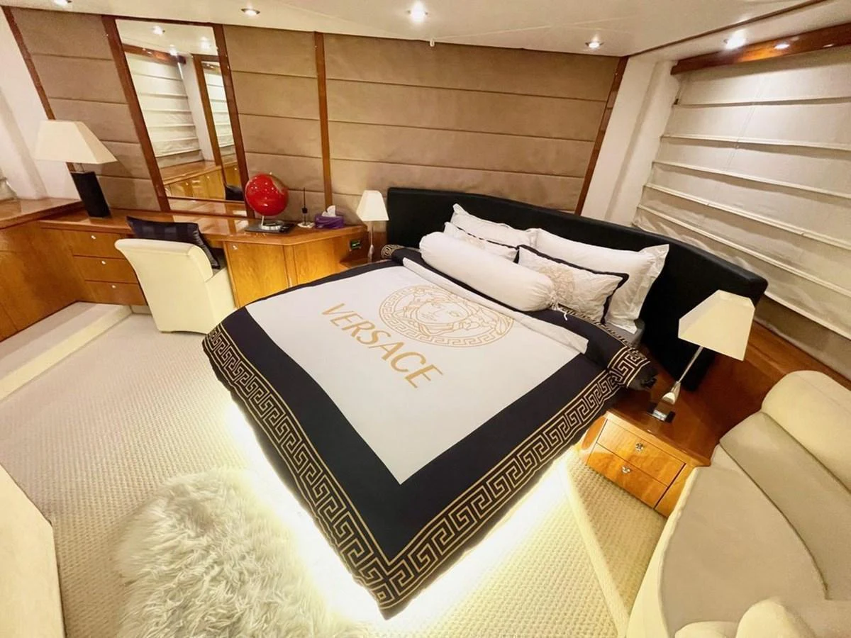 The master stateroom exudes luxury with its elegant bedding and sophisticated decor. aboard ELLYN Yacht for Sale