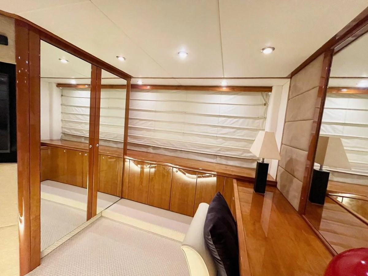 The yacht's interior features a cozy and well-lit space with wooden accents and comfortable furnishings. aboard ELLYN Yacht for Sale