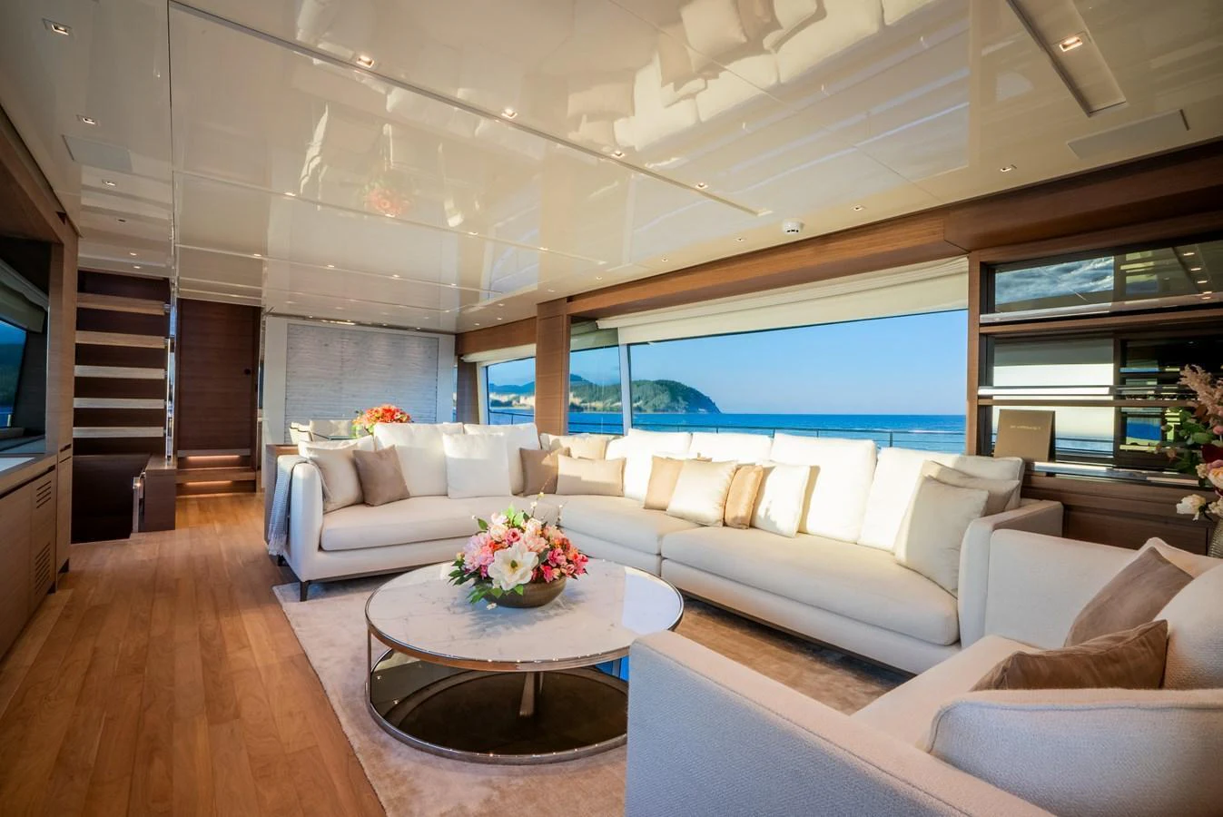 The spacious salon features elegant furnishings and panoramic ocean views. aboard ASTRIMARE Yacht for Sale