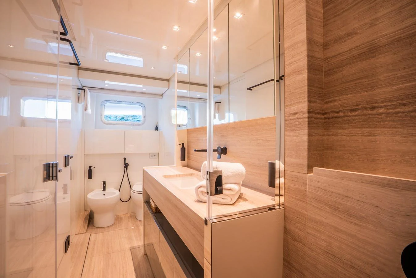 The yacht's bathroom features modern fixtures and a sleek design with ample natural light. aboard ASTRIMARE Yacht for Sale