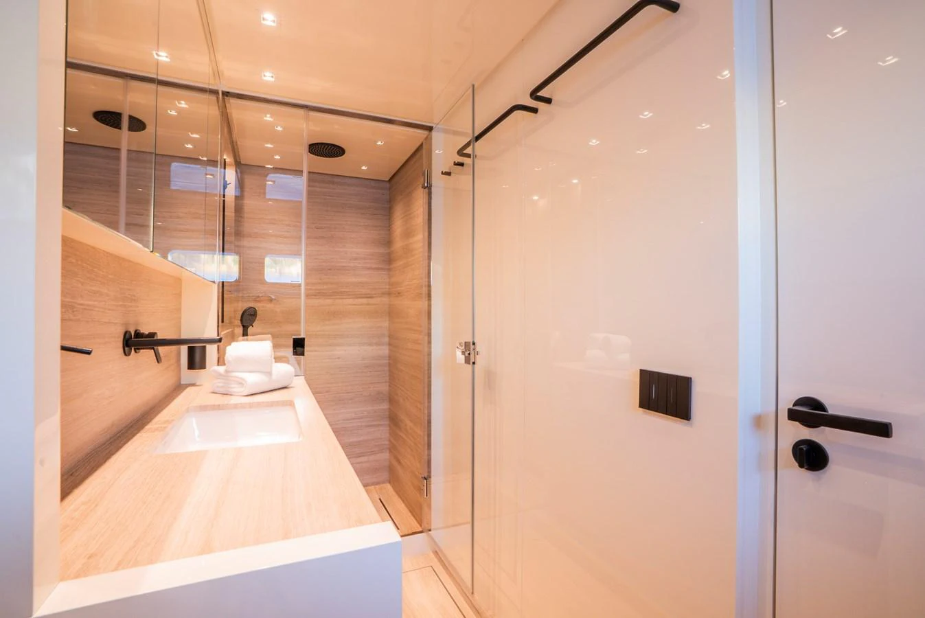 A luxurious yacht bathroom featuring sleek design and modern fixtures. aboard ASTRIMARE Yacht for Sale