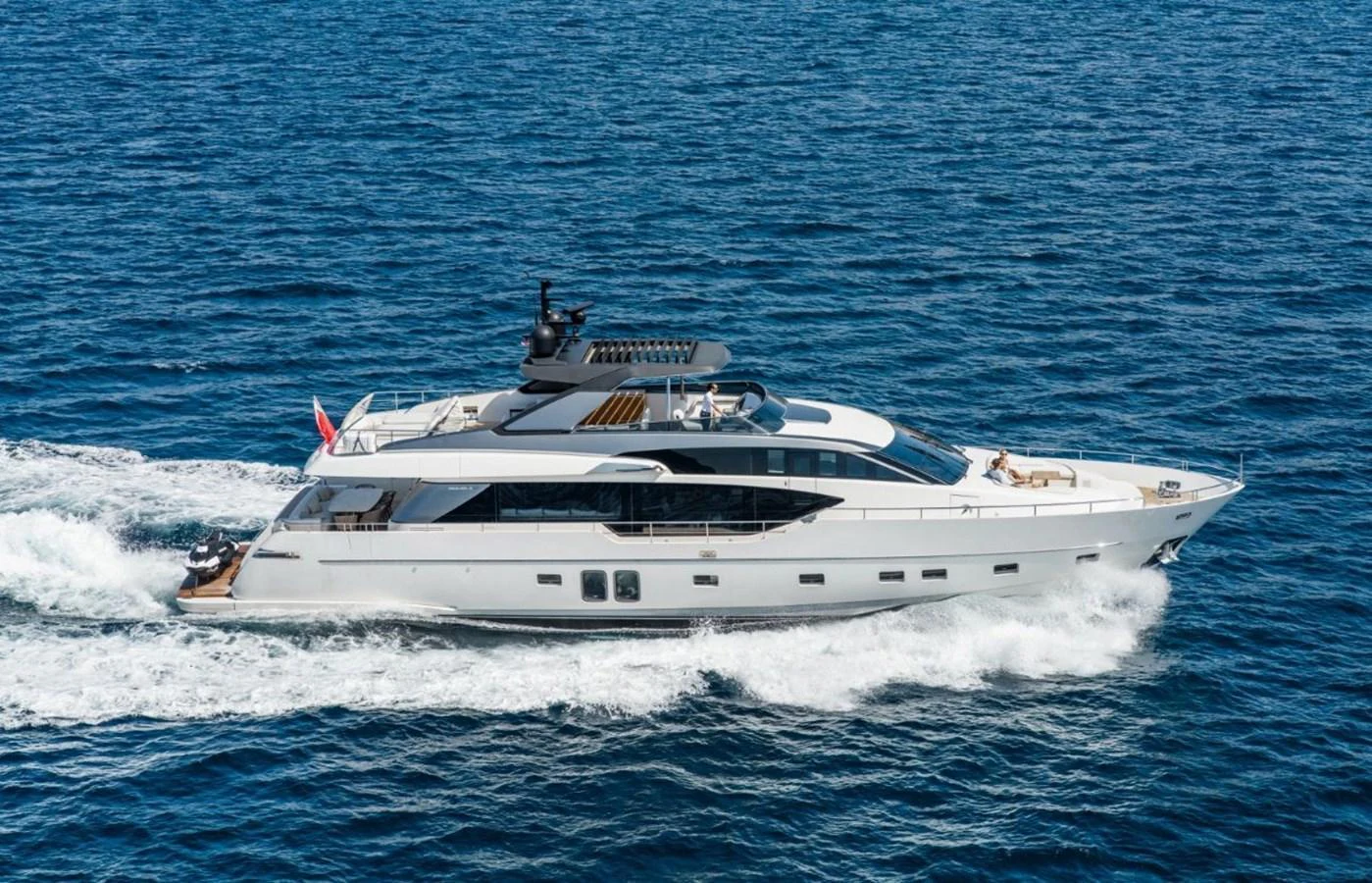 A sleek and modern yacht cruising on open water, showcasing its elegant design and luxurious amenities. aboard ASTRIMARE Yacht for Sale