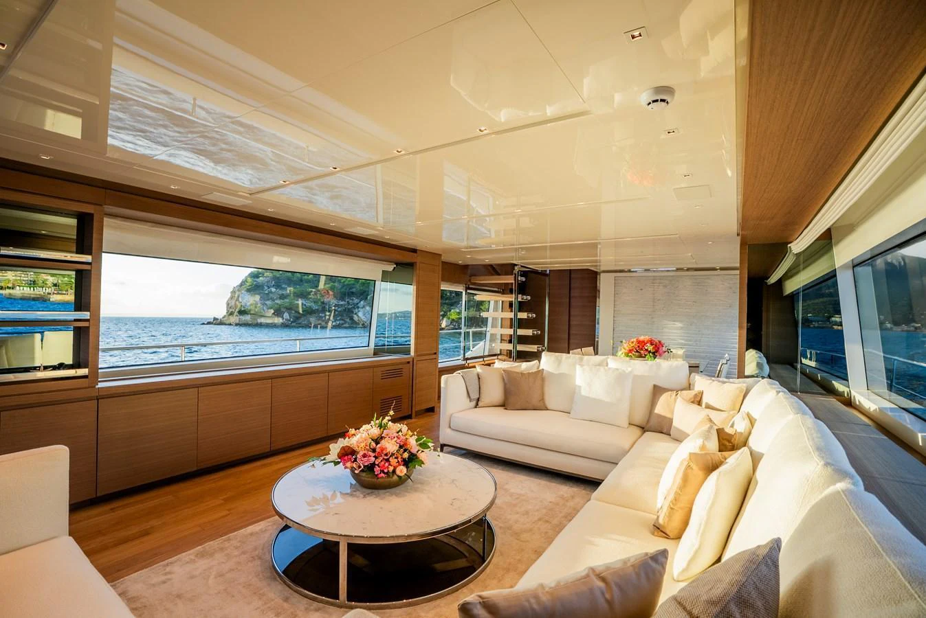The salon offers a luxurious and spacious seating area with panoramic views of the sea. aboard ASTRIMARE Yacht for Sale
